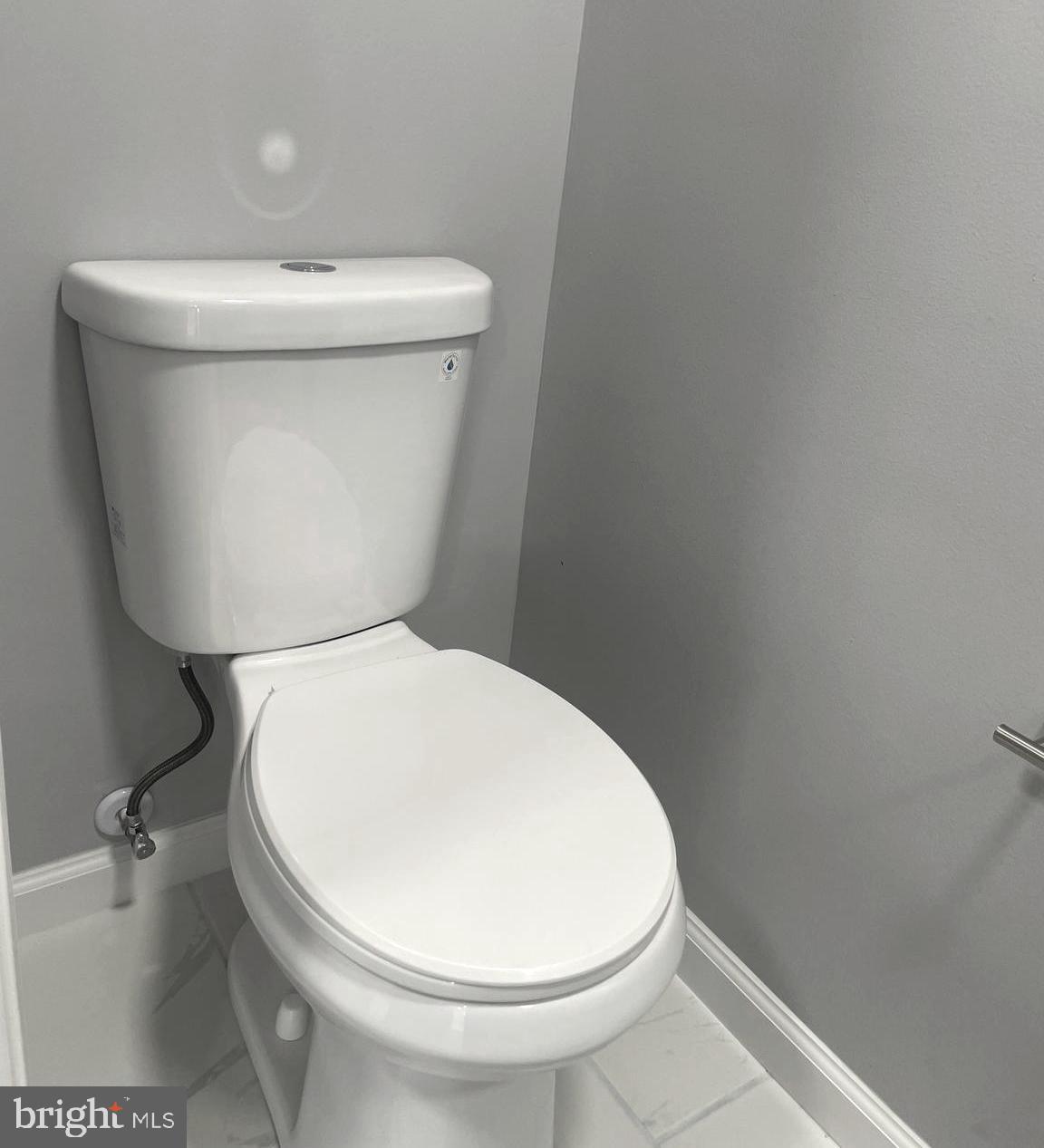 6107 Buckler Road Clinton, MD 20735 - Photo 14 of 45 a white toilet sitting next to a white sink