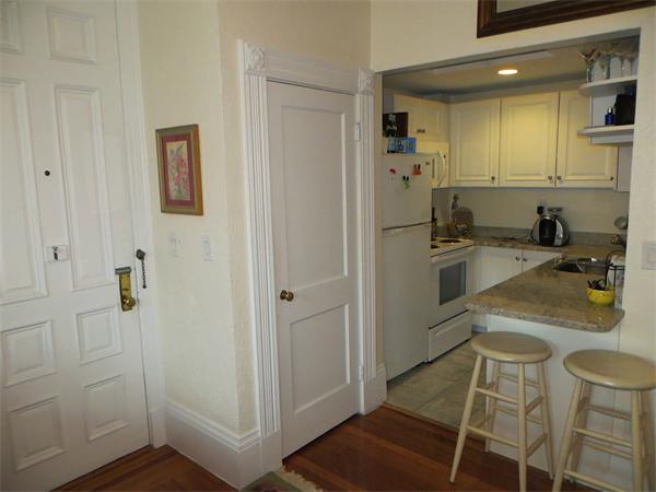 342 Commonwealth Avenue, Unit 3 Boston, MA 02115 - Photo 4 of 6 a kitchen with a sink and refrigerator