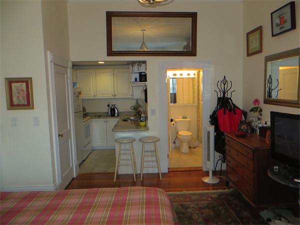 342 Commonwealth Avenue, Unit 3 Boston, MA 02115 - Photo 6 of 6 a living room with a furniture and a flat screen tv