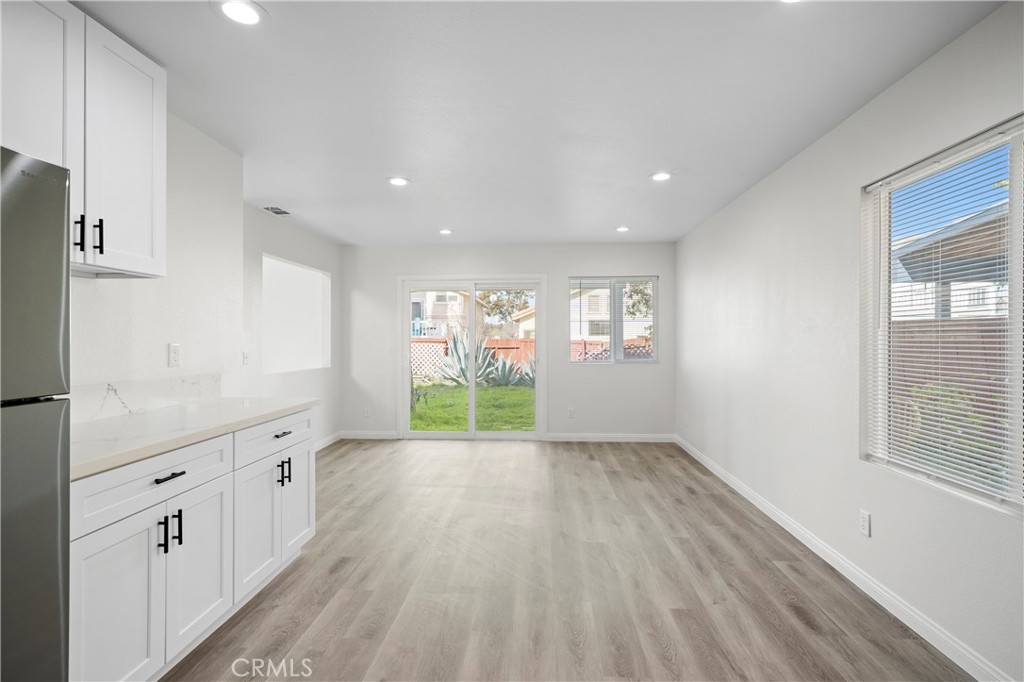 33034 Romero Drive Temecula, CA 92592 - Photo 12 of 21 a large kitchen with hard wood floors and windows