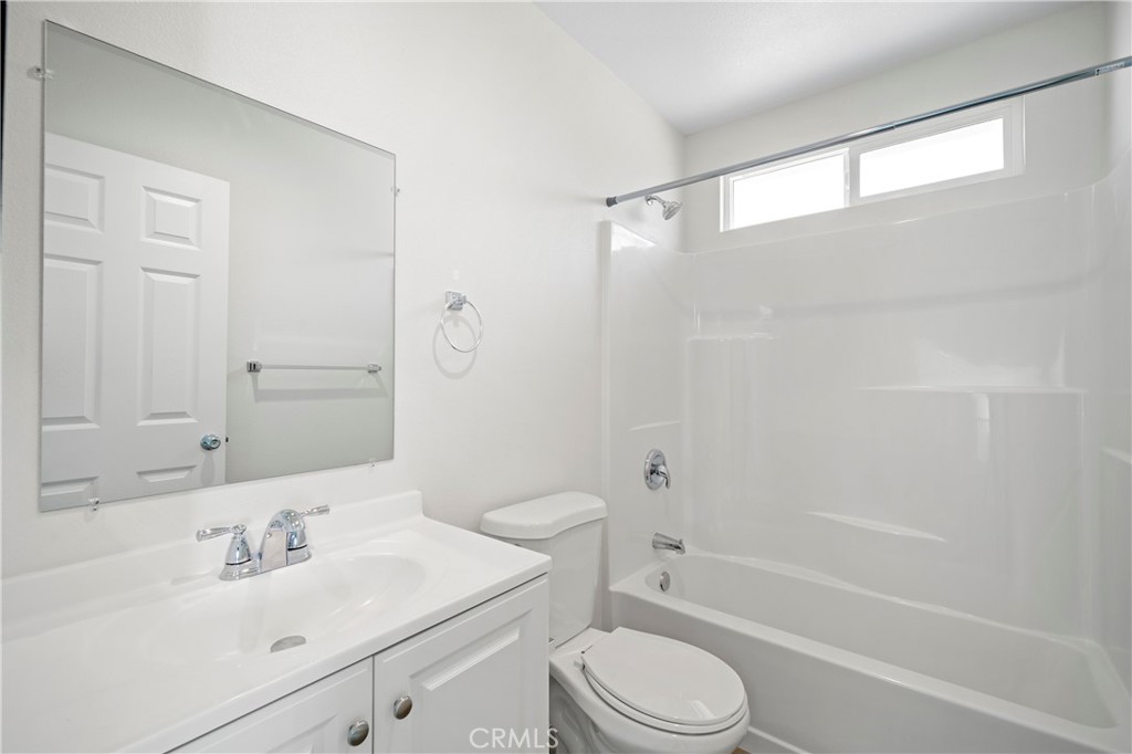 33034 Romero Drive Temecula, CA 92592 - Photo 19 of 21 a bathroom with a sink toilet and shower
