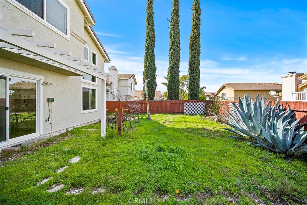 33034 Romero Drive Temecula, CA 92592 - Photo 20 of 21 a view of backyard with a huge green area and wooden fence