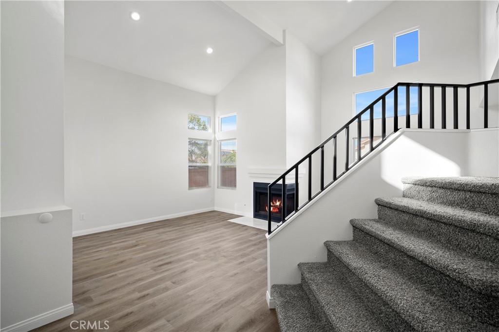 33034 Romero Drive Temecula, CA 92592 - Photo 6 of 21 a view of staircase with wooden floor and a window