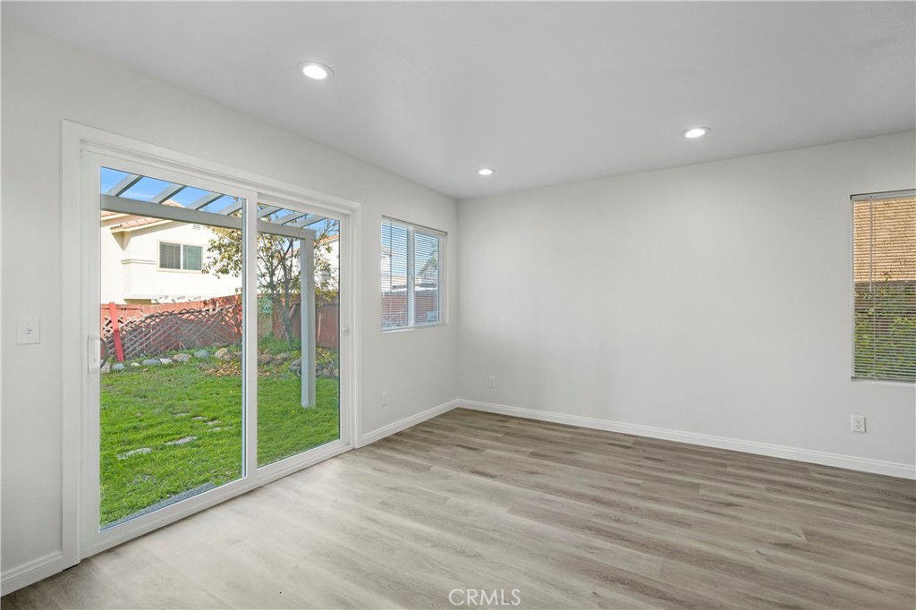 33034 Romero Drive Temecula, CA 92592 - Photo 7 of 21 a view of an empty room with wooden floor and a window