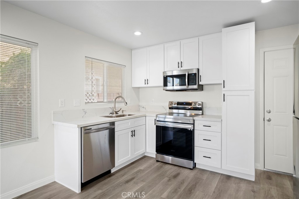 33034 Romero Drive Temecula, CA 92592 - Photo 10 of 21 a kitchen with stainless steel appliances granite countertop a stove and a sink