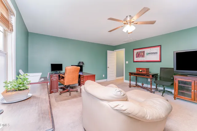 a bathroom with a toilet a sink and a mirror