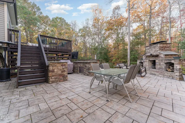 a front view of a house with outdoor seating