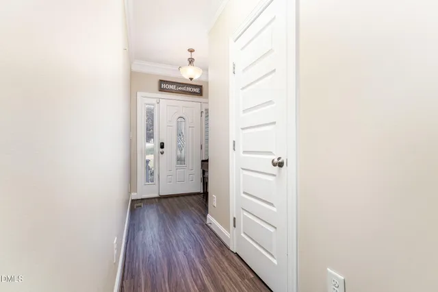 a living room with furniture or kitchen view and a chandelier