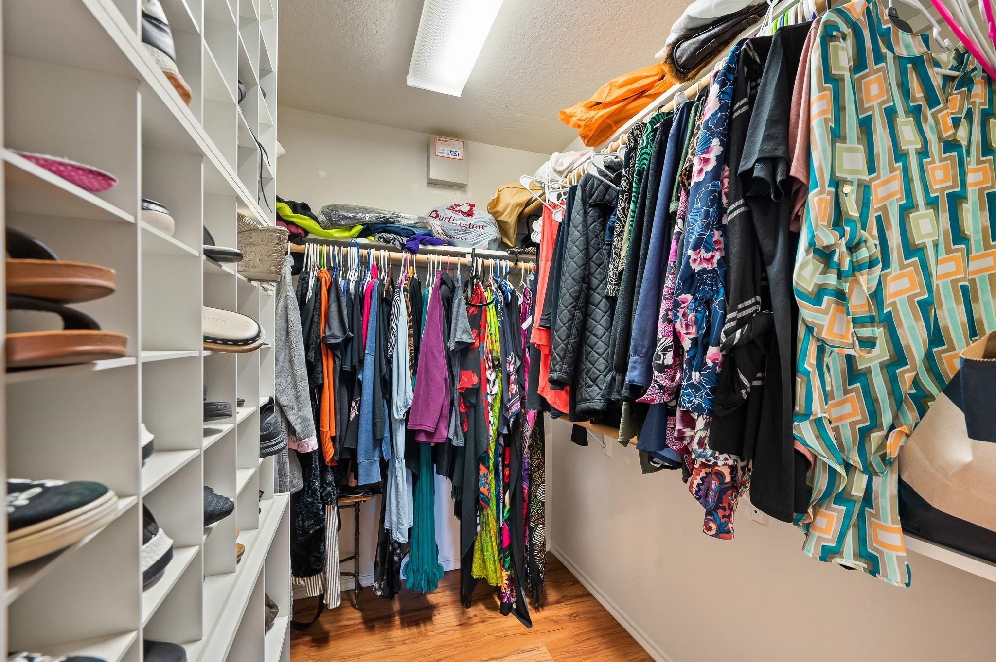 13600 Breton Ridge Street, Unit 25E Houston, TX 77070 - Photo 22 of 39 a view of walk in closet with clothes