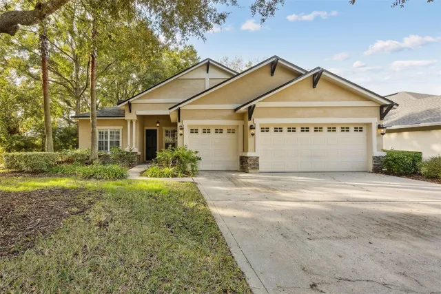 a kitchen with kitchen island granite countertop a sink cabinets and stainless steel appliances