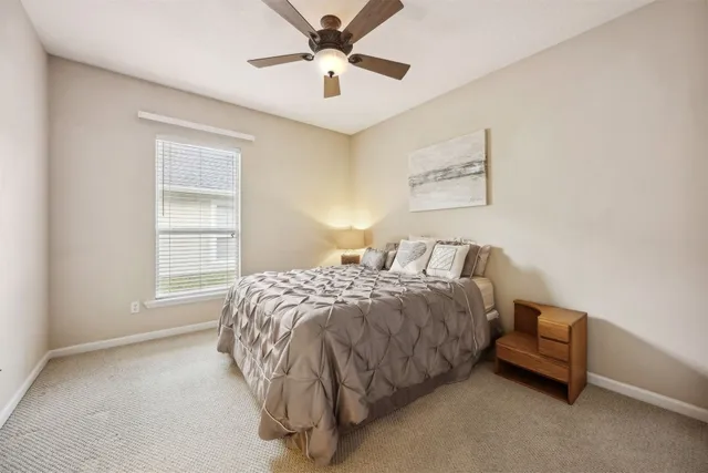 an aerial view of lake residential house with swimming pool and outdoor space