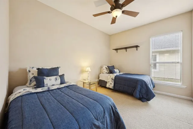 swimming pool view with a seating space