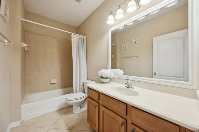 an aerial view of a house with a swimming pool