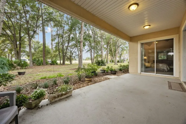 a view of an empty room with windows