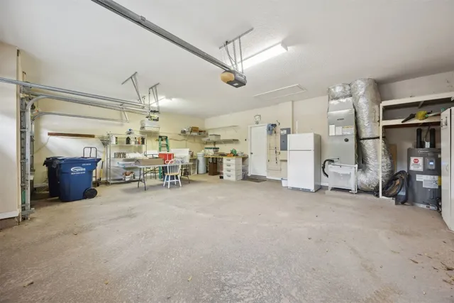 an aerial view of a house with outdoor space patio and outdoor seating