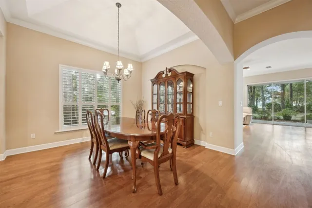 a view of a livingroom with wooden floor and a cabinet