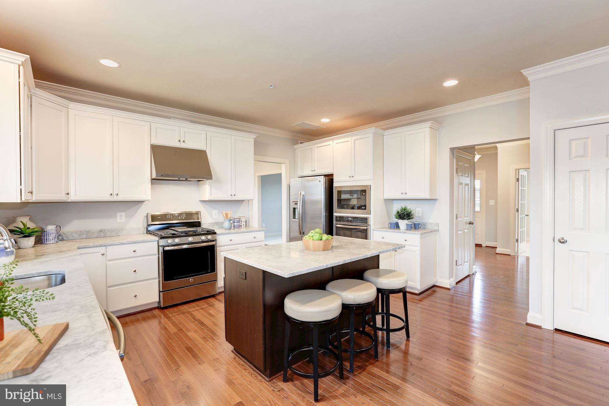 17005 Bennett Way Poolesville, MD 20837 - Photo 13 of 27 Kitchen w/ island and stainless steel appliances