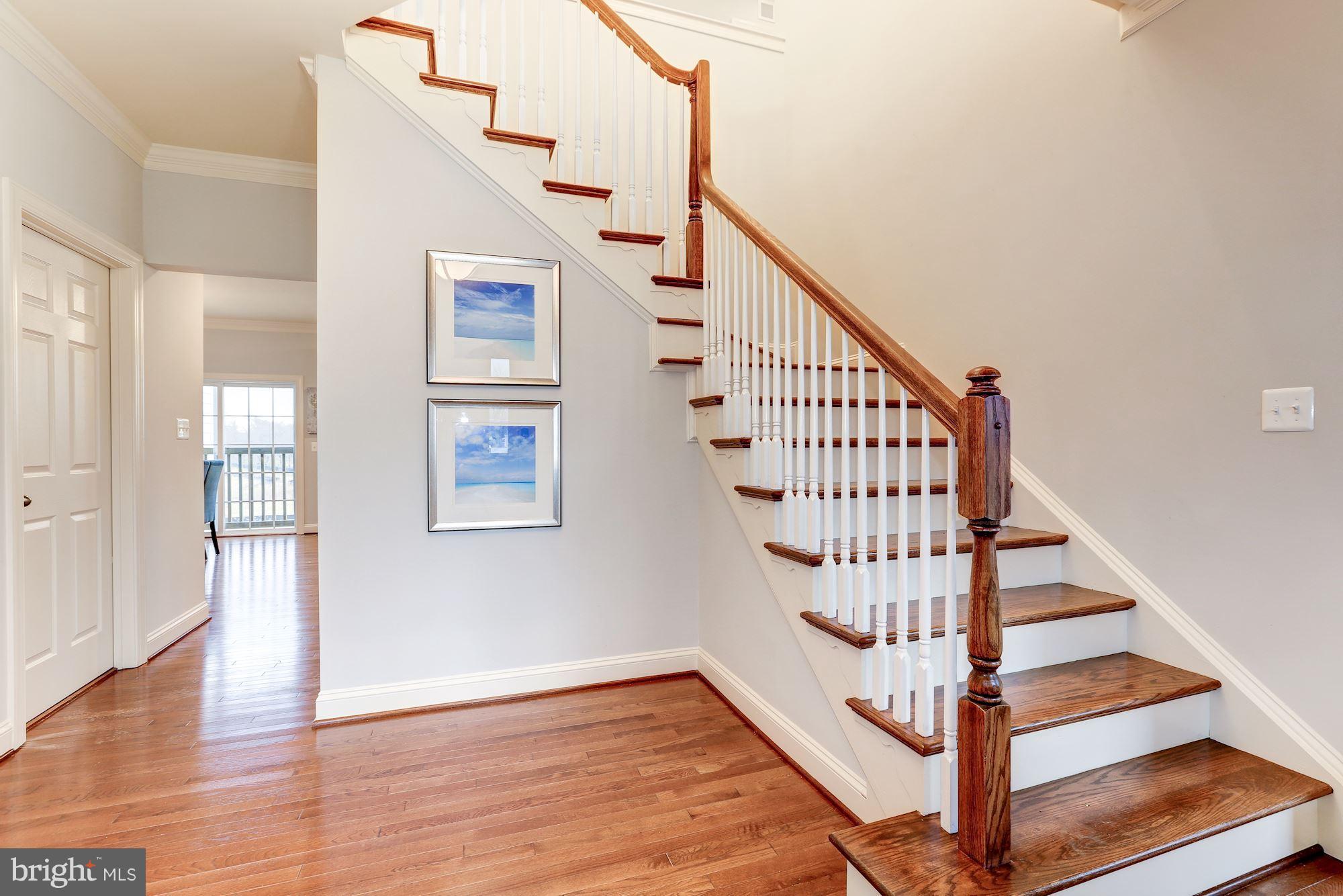 17005 Bennett Way Poolesville, MD 20837 - Photo 3 of 27 Staircase sanded/stained to match floors.
