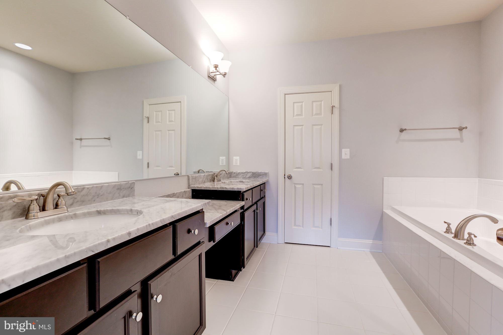 17005 Bennett Way Poolesville, MD 20837 - Photo 25 of 27 Master Bathroom with double marble vanities.