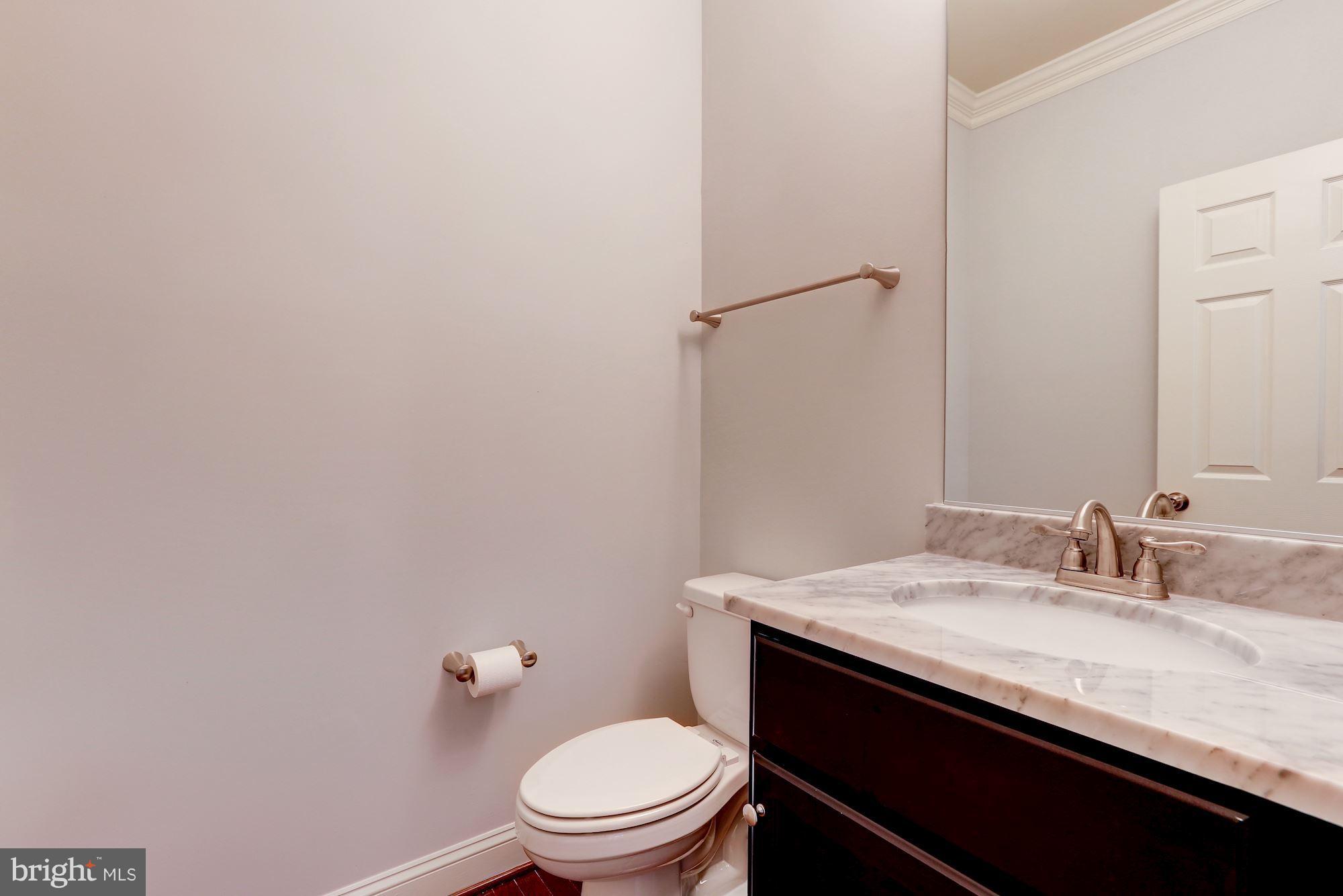 17005 Bennett Way Poolesville, MD 20837 - Photo 4 of 27 Powder Room with Marble Vanity