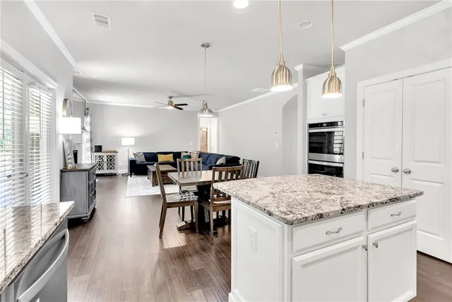 a open kitchen with a table and chairs in it