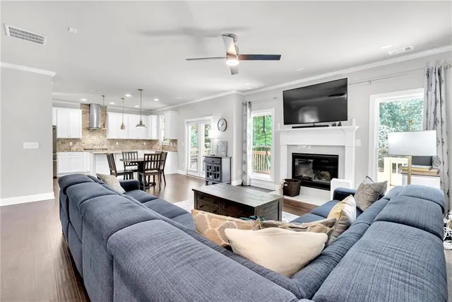 a living room with furniture fireplace and a flat screen tv