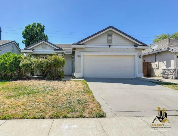a front view of a house with yard