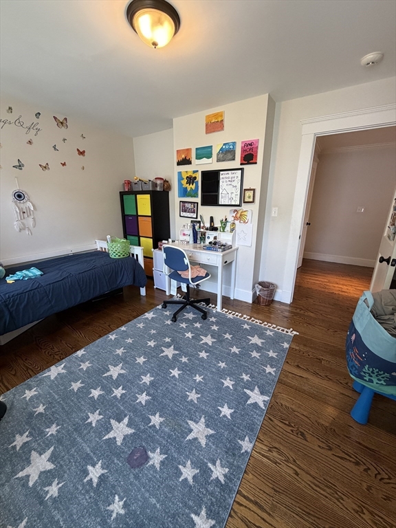17 Cardinal Street, Unit 17 Winchester, MA 01890 - Photo 22 of 42 a living room with furniture and a wooden floor