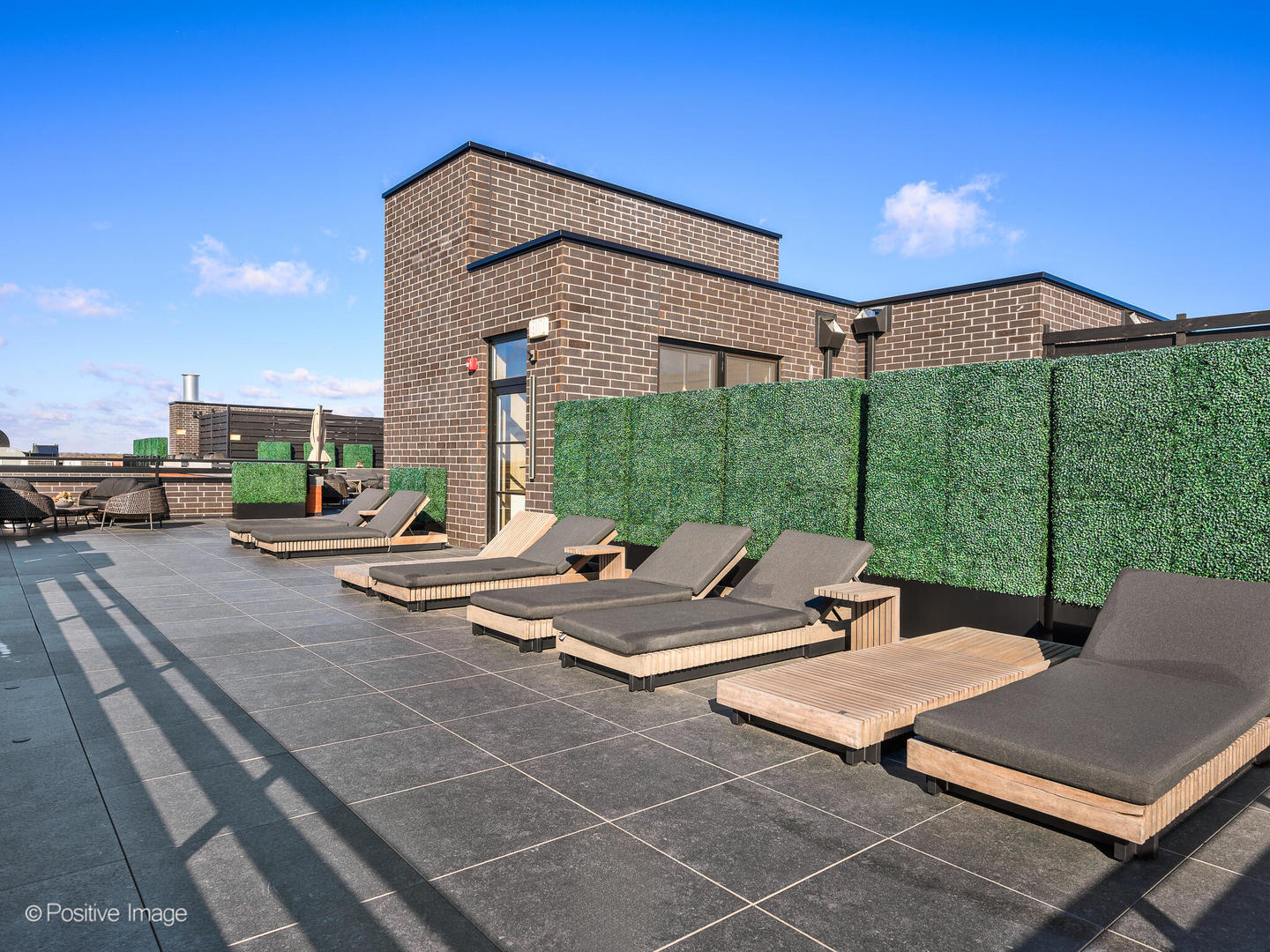 11 West Prospect Avenue, Unit 214 Mount Prospect, IL 60056 - Photo 20 of 32 a view of a patio with a table and chairs under an umbrella