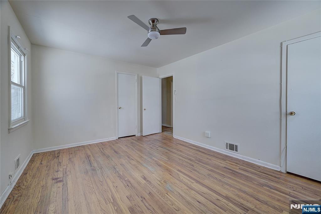 27 Old Short Hills Road West Orange, NJ 07052 - Photo 14 of 35 wooden floor in an empty room with a window