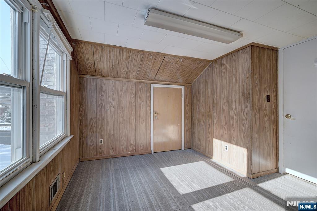 27 Old Short Hills Road West Orange, NJ 07052 - Photo 19 of 35 a view of an empty room with wooden floor and a window