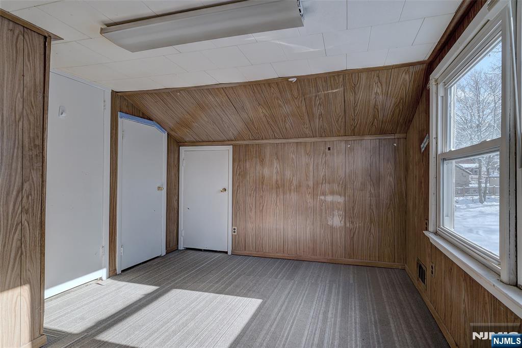 27 Old Short Hills Road West Orange, NJ 07052 - Photo 20 of 35 an empty room with wooden floor and windows