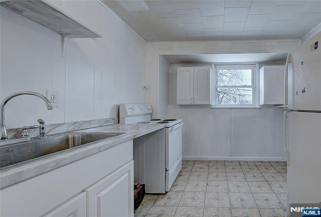 27 Old Short Hills Road West Orange, NJ 07052 - Photo 26 of 35 a kitchen with a sink and cabinets