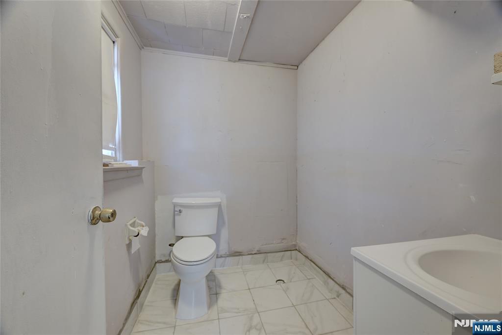 27 Old Short Hills Road West Orange, NJ 07052 - Photo 30 of 35 a bathroom with a toilet and a sink