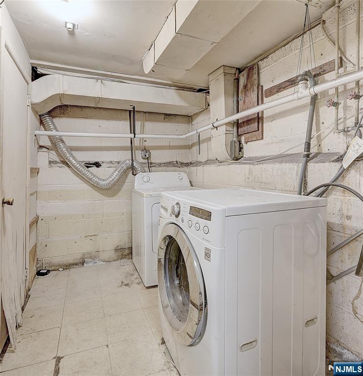 27 Old Short Hills Road West Orange, NJ 07052 - Photo 31 of 35 a utility room with dryer and washer