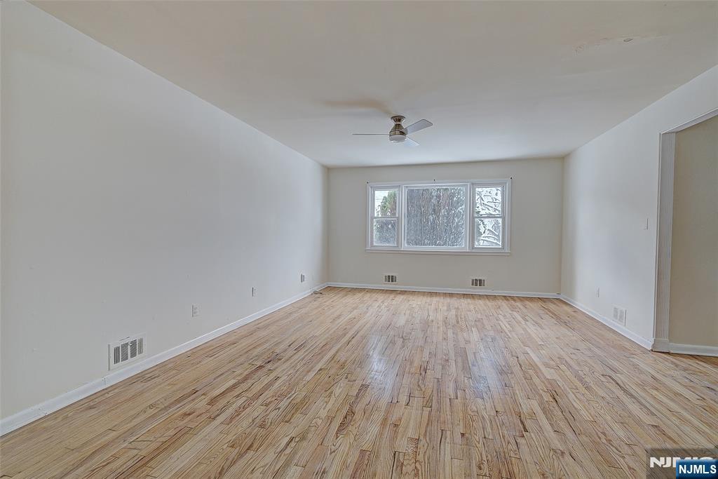 27 Old Short Hills Road West Orange, NJ 07052 - Photo 5 of 35 a view of a room that has wooden floor and window in it