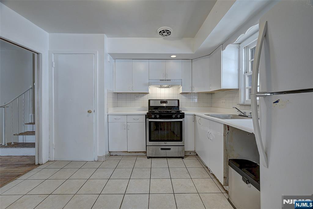 27 Old Short Hills Road West Orange, NJ 07052 - Photo 8 of 35 a kitchen with a cabinets and white appliances