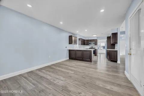 a view of kitchen with wooden floor