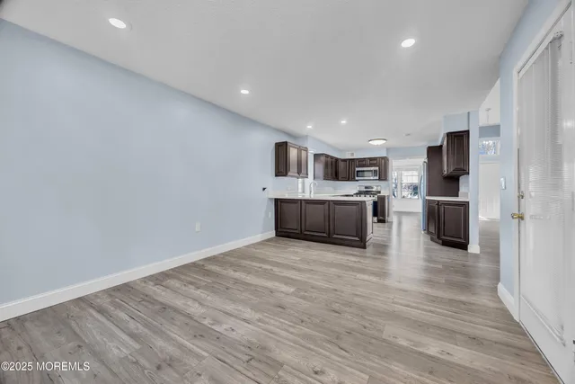 a view of kitchen with wooden floor