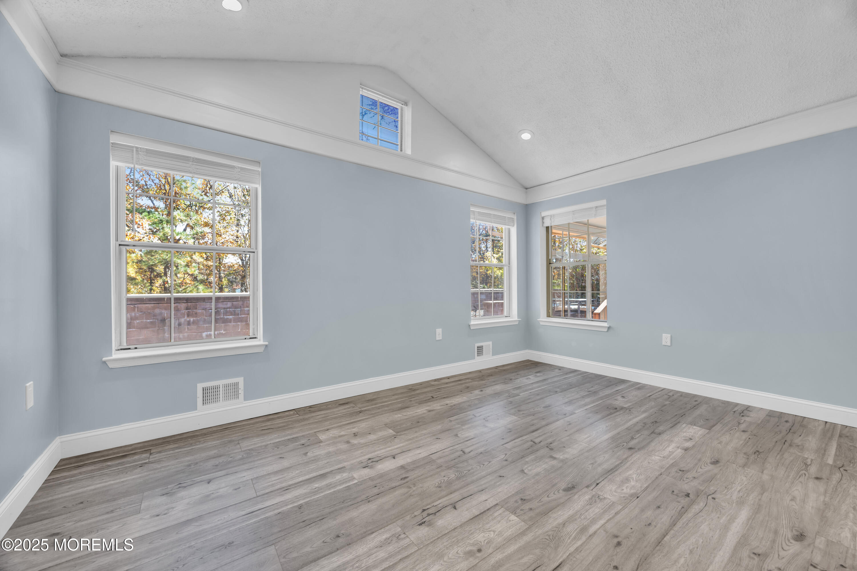 12 Thatcher Court Jackson, NJ 08527 - Photo 19 of 50 an empty room with wooden floor and windows