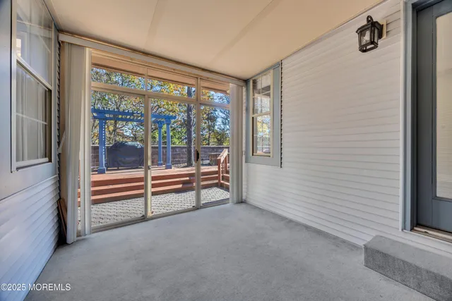 a view of a house with wooden roof and sitting area