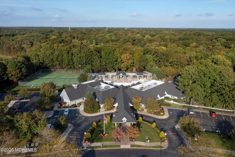 an aerial view of a building with outdoor space and street view
