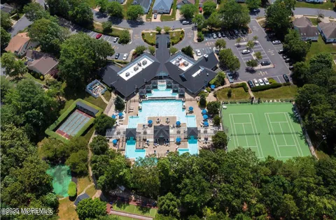 an aerial view of multiple houses with yard