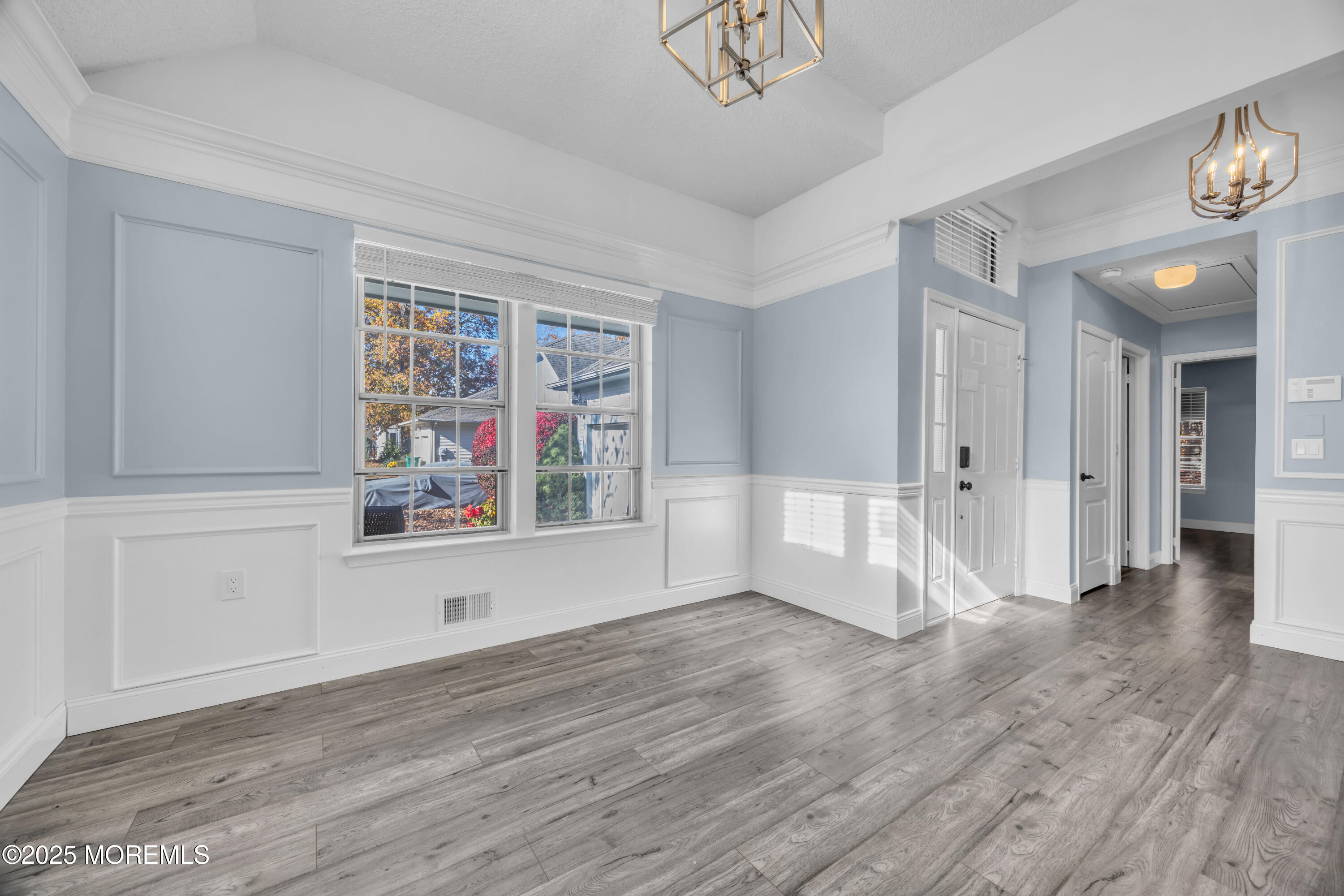 12 Thatcher Court Jackson, NJ 08527 - Photo 4 of 50 an empty room with wooden floor and windows