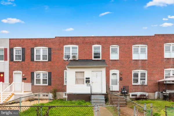 a front view of a building with garden