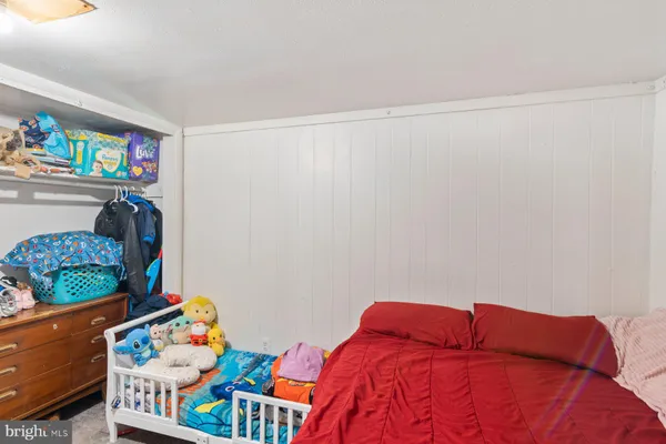 a bedroom with a bed and a window in it