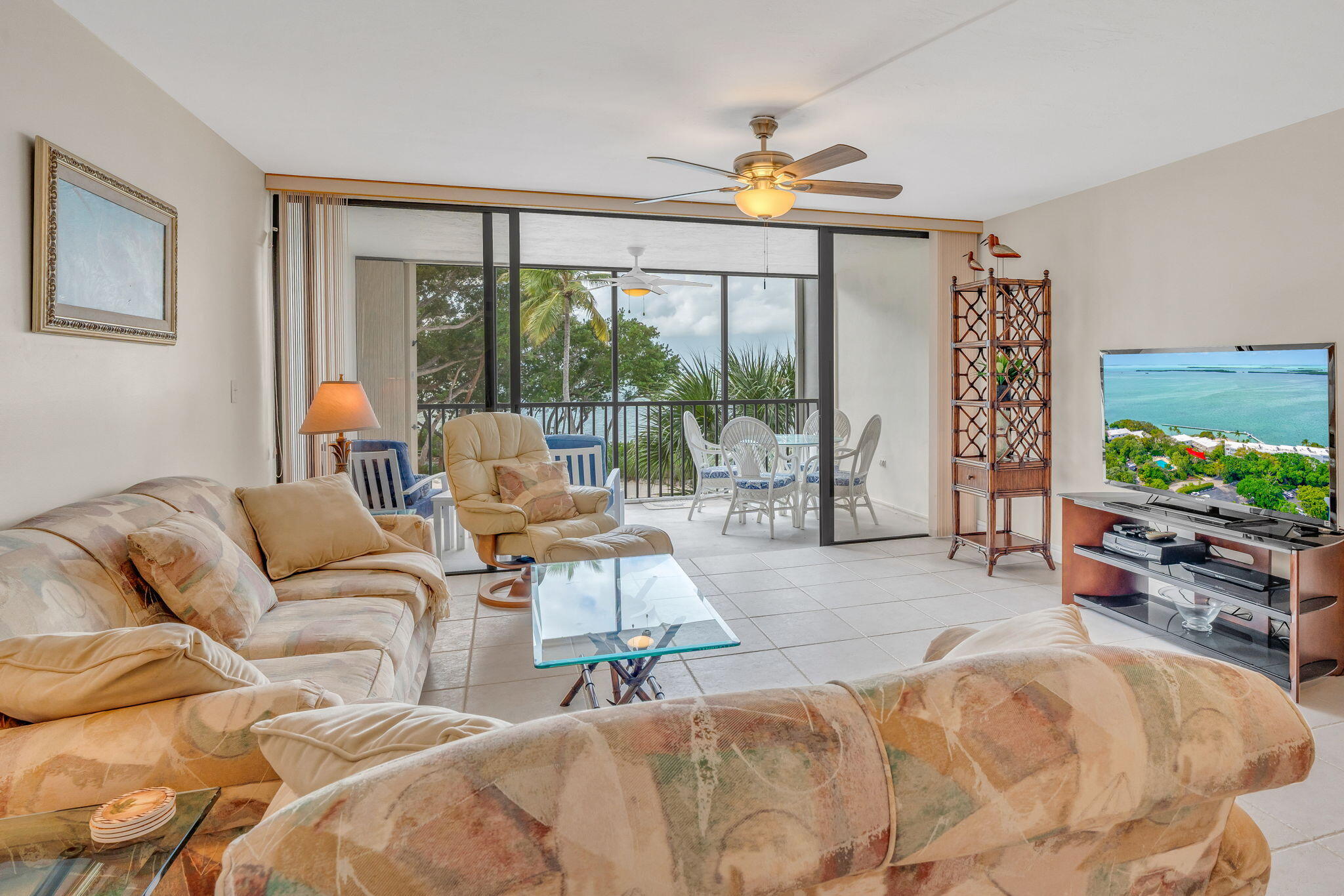 97652 Overseas Highway, Unit P6 Key Largo, FL 33037 - Photo 11 of 79 a living room with furniture and a flat screen tv