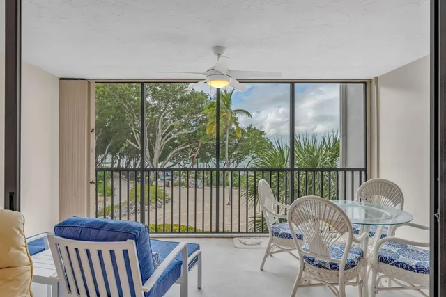 a bathroom with a granite countertop sink mirror and toilet
