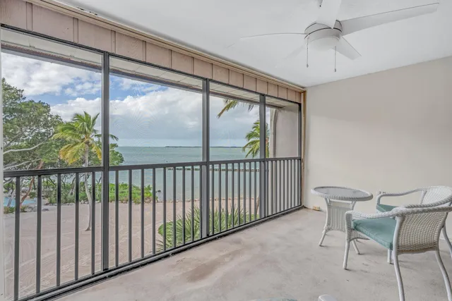 a view of a chairs and table in patio