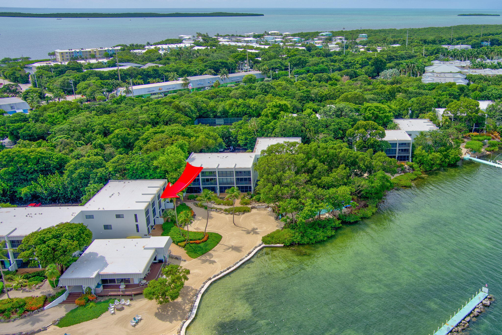 97652 Overseas Highway, Unit P6 Key Largo, FL 33037 - Photo 29 of 79 an aerial view of a house with a yard and lake view